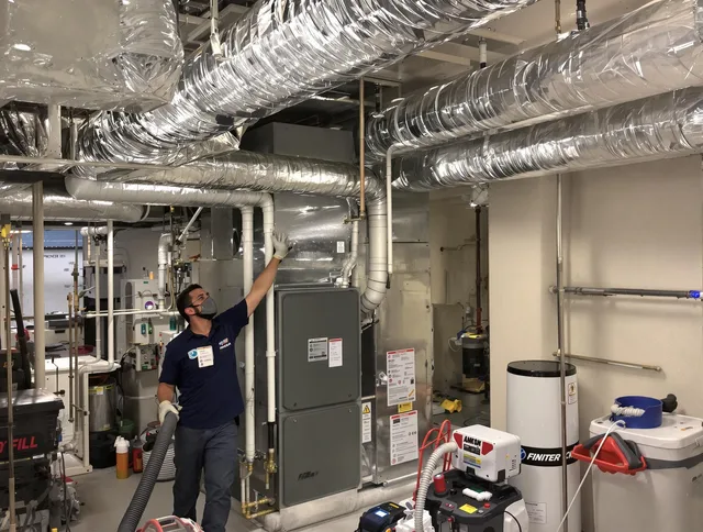 Bristol Air Duct Cleaning specialist performing thorough furnace duct cleaning in a Bristol residence