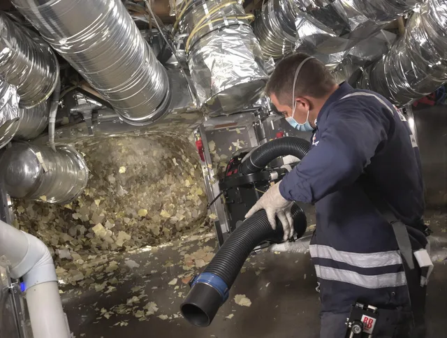 Bristol Air Duct Cleaning specialist operating negative pressure cleaning equipment for thorough duct maintenance in Bristol