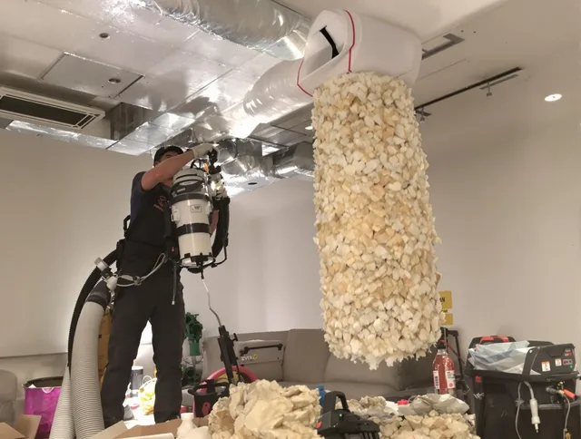 Bristol Air Duct Cleaning technician performing precision vacuum insulation removal in a residential property in Bristol