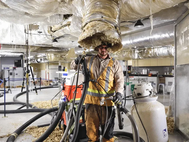 Professional vacuum insulation removal by Bristol Air Duct Cleaning expert in Bristol